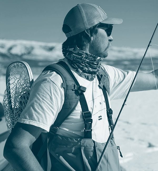 Young fisherman with waders
